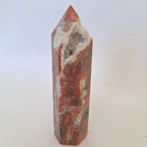 Sunstone tower, with sports of blue apatite and druzzy cavern 42gm, 7cm